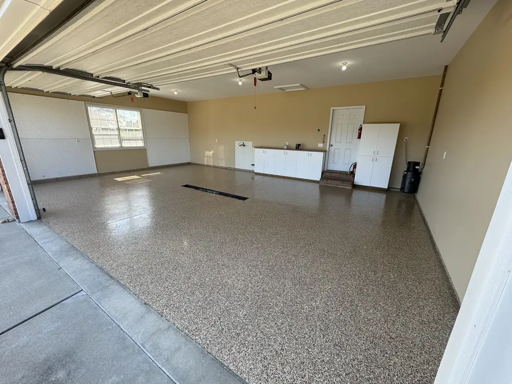 Brown and gray epoxy flake garage floor in a finished residential garage