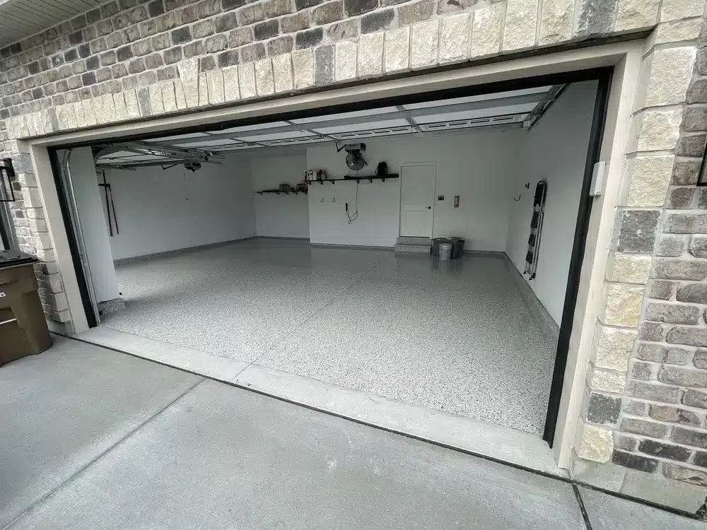Light gray epoxy flake floor in a finished two-car residential garage