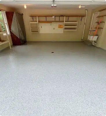 Light gray epoxy flake garage floor in a clean residential garage