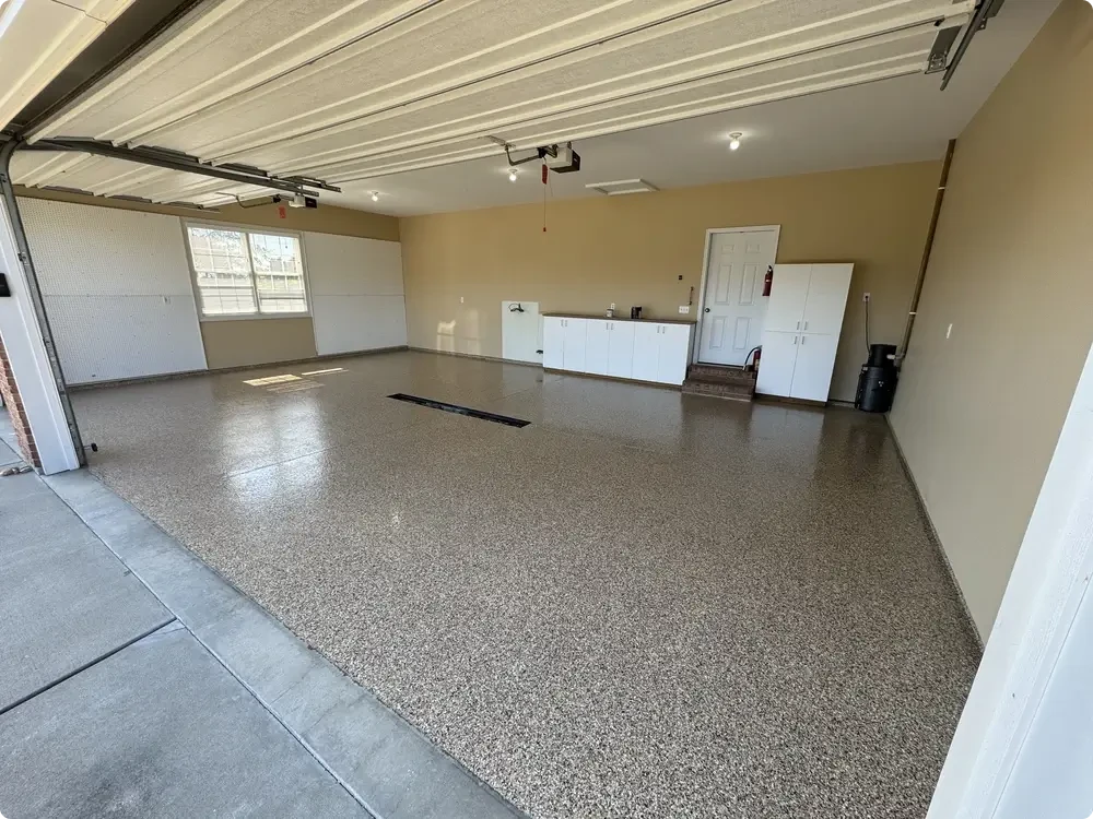 Gray epoxy flake garage floor in a finished residential garage in Chesterfield, Missouri