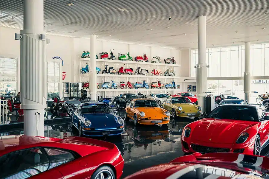 Luxury cars in a showroom, an example of showroom epoxy flooring in use