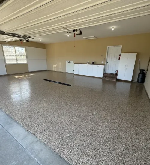 Brown and gray epoxy flake garage floor in a finished residential garage
