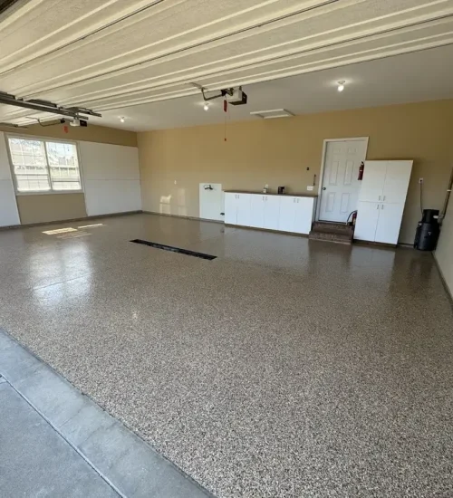 Gray epoxy flake garage floor in a finished residential garage in Chesterfield, Missouri