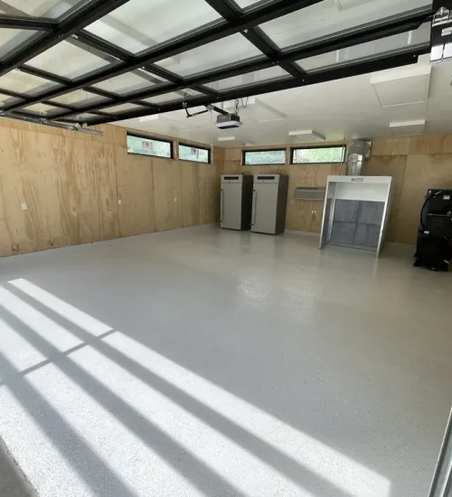 Light gray epoxy garage floor in a finished residential garage in Washington, Missouri