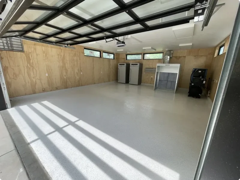 Light gray epoxy garage floor in a finished residential garage in Washington, Missouri