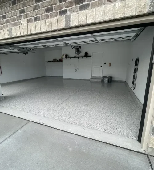 Gray epoxy flake garage floor in a two-car garage in Wildwood, Missouri