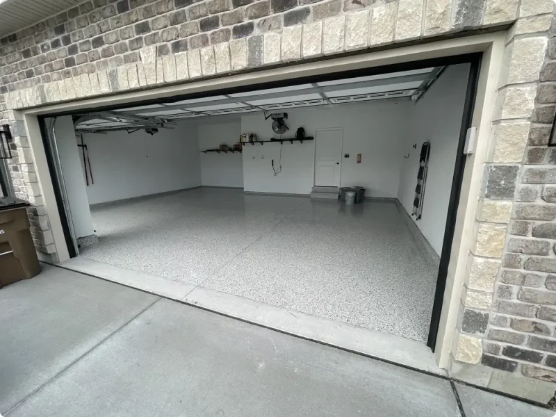 Gray epoxy flake garage floor in a two-car garage in Wildwood, Missouri